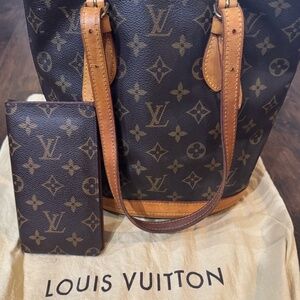 Authentic Louis Vuitton Barrel bag set with checkbook & dust cover bag.